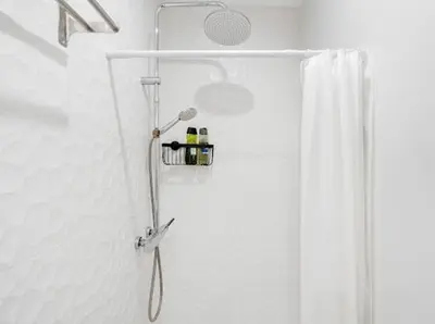 a shower in a bathroom with a shower curtain at Apartments near the airport in Cornellà de Llobregat