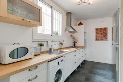 a kitchen with a sink and a microwave at Rambla Catalunya Sky in Barcelona