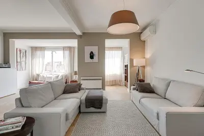 a living room with two couches and a table at Rambla Catalunya Sky in Barcelona