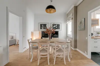 a kitchen and dining room with a table and chairs at Rambla Catalunya Sky in Barcelona