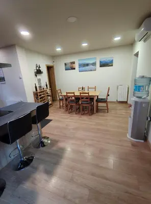 a room with a dining room with a table and chairs at Estrella Relax in Vallirana