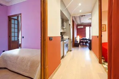 a room with a bed and a kitchen in it at Catalunya Executive 3 bedrooms, 3 bathrooms AC wifi in Barcelona