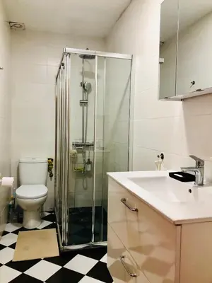 a bathroom with a shower and a toilet and a sink at Habitación privada junto al mar en la Barceloneta in Barcelona