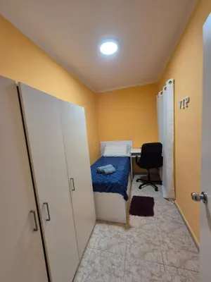 a small room with a bed and a desk at Mary home in Barcelona