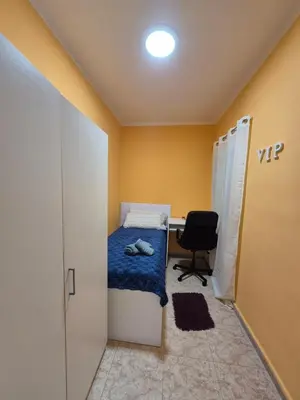 a room with a bed and a desk and a chair at Mary home in Barcelona