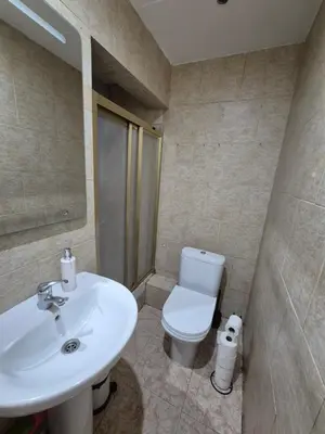 a bathroom with a white sink and a toilet at Mary home in Barcelona