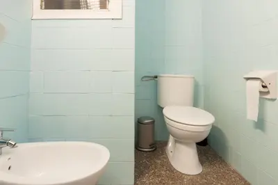 a bathroom with a toilet and a sink at Pubone AT Barberà del Valles in Barbera del Valles