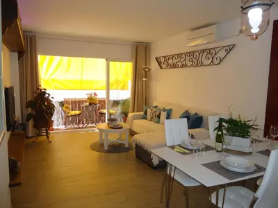 a living room with a couch and a table at Apartment Dolce Vita lovely in Sitges