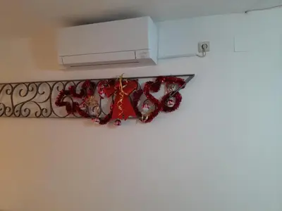 a banner hanging on a wall next to a heater at Apartment Dolce Vita lovely in Sitges