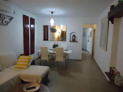 a living room with a table and a dining room at Apartment Dolce Vita lovely in Sitges
