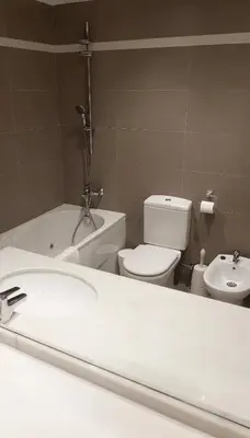 a bathroom with a white sink and a toilet at Luz y Mar II in Barcelona