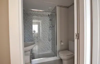 a bathroom with a shower and a sink and a toilet at Luz y Mar II in Barcelona