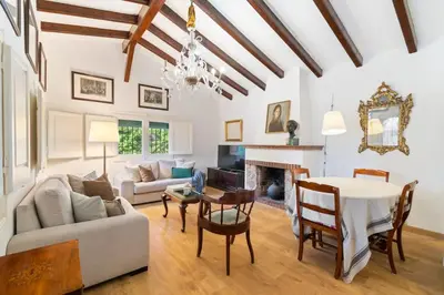 a living room with a table and a dining room at Casa Alba Garden & Calm in Sitges
