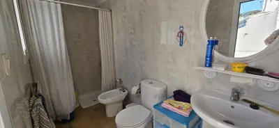 a bathroom with a toilet and a sink and a mirror at Metrópolis in Barcelona