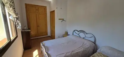 a bedroom with a bed and a window and a door at Metrópolis in Barcelona