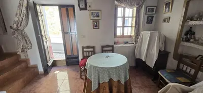 a room with a table and a table and chairs at Metrópolis in Barcelona