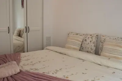 a bedroom with a bed and a mirror at Cathedral Charm on Via Lantana in Barcelona