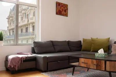 a living room with a couch and a table at Cathedral Charm on Via Lantana in Barcelona