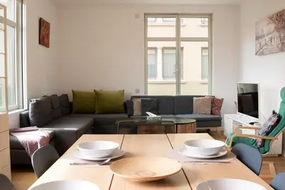 a living room with a couch and a table at Cathedral Charm on Via Lantana in Barcelona