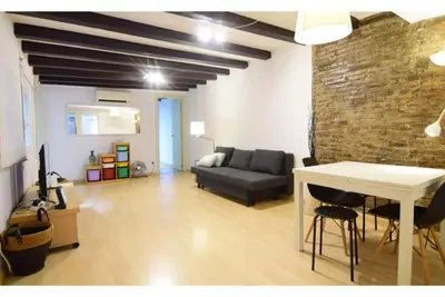 a living room with a couch and a table at Apartment in the heart of Barcelona in Barcelona