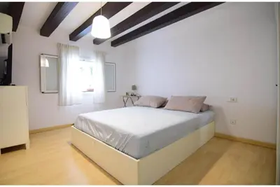 a bedroom with a white bed in a room at Apartment in the heart of Barcelona in Barcelona