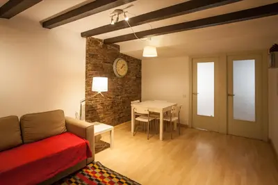 a living room with a couch and a table at Apartment in the heart of Barcelona in Barcelona