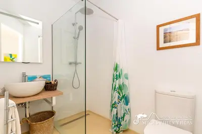 a bathroom with two fish on the wall at Casa Sian Retreat near Sitges in Olivella