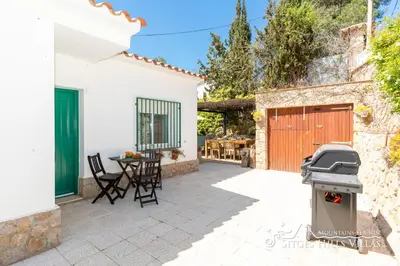 a kitchen with a stove and a window at Casa Sian Retreat near Sitges in Olivella