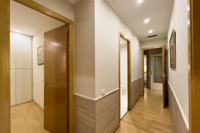 a hallway with a door leading into a room at Gran Vía Sun in Barcelona