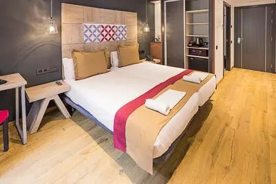a bedroom with a large bed in a room at Boutique Hostemplo Sagrada Familia in Barcelona