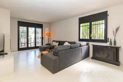 a staircase in a home with a green door at Villa Caliza in Cunit with Private Pool and large garden - air conditioning in bedroom in Cunit