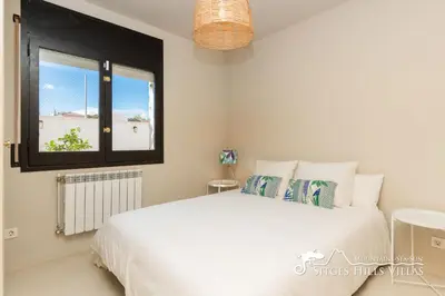 a door leading into a room with a bedroom at Villa Caliza in Cunit with Private Pool and large garden - air conditioning in bedroom in Cunit