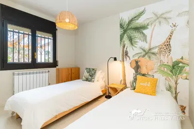 a bathroom with a sink and a toilet and a mirror at Villa Caliza in Cunit with Private Pool and large garden - air conditioning in bedroom in Cunit