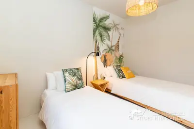 a bedroom with a white bed and a window at Villa Caliza in Cunit with Private Pool and large garden - air conditioning in bedroom in Cunit