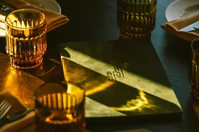 a table with two glasses and a star with the word exit at The Social Hub Barcelona Poblenou Extended Stay in Barcelona