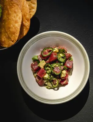 a plate of food with vegetables on a table at The Social Hub Barcelona Poblenou Extended Stay in Barcelona