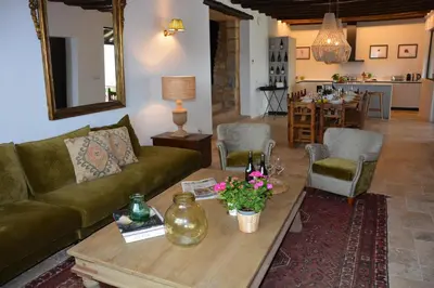 a living room with a couch and a coffee table at Masia La Morera autenticidad renovada 100 porcien a 10 minutos de Sitges en coche 12 huespedes Piscina Aire Aconc 6 Suites Apertura 15 Julio 2025 in Viladellops
