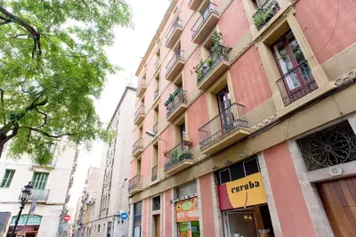a building on the side of a street at Sunny apartment on the square in Barcelona