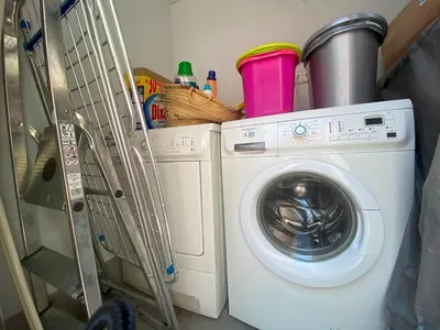 a washing machine sitting next to a washer at PISO FILIPPO in Barcelona