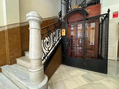 an entrance to a building with a wrought iron door at MODERN ELEGANCE by MyRentalHost in Barcelona