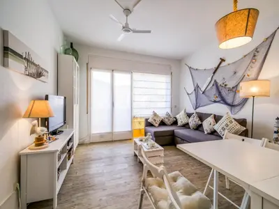 a living room with a couch and a table at Apartment in Calella near the Beach in Calella