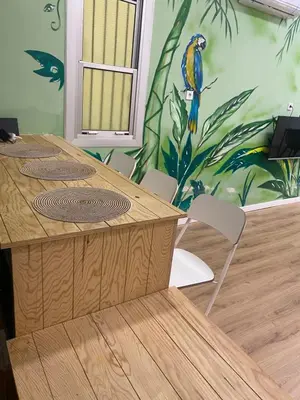 a table and chairs with a bird on the wall at Barcelona Home in Barcelona