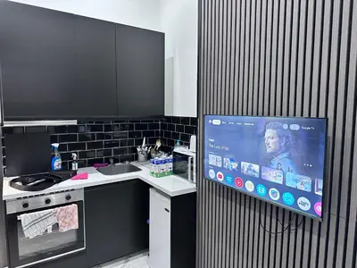 a living room with a black and white shower curtain at Casa hamburg BCN in Badalona