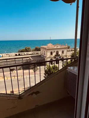 a view of the ocean from the balcony of a building at Apartamento en 1ª línea con vistas al mar cerca de Barcelona in Pineda de Mar