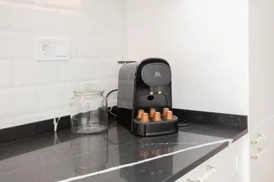 a coffee maker sitting on a counter in a kitchen at Bright & Stylish Flat In Trendy Grcia in Barcelona