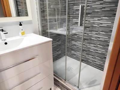 a bathroom with a shower and a sink at La Habitación de Santa Eulalia habitación privada in Hospitalet de Llobregat