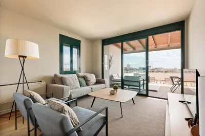 a living room with a couch and a table at OLA LIVING - MT - Aire 1 in Barcelona