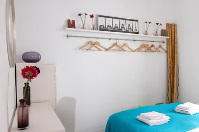 a room with a bed and a table with towels at Housalia Ondina Suites Sagrada Familia in Barcelona