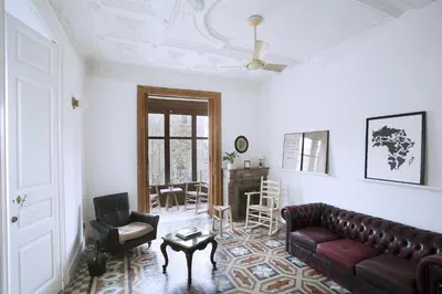 a living room with a couch and a chair at yök Casa Cultura in Barcelona