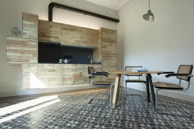 a conference room with a table and chairs and a tv at yök Casa Cultura in Barcelona